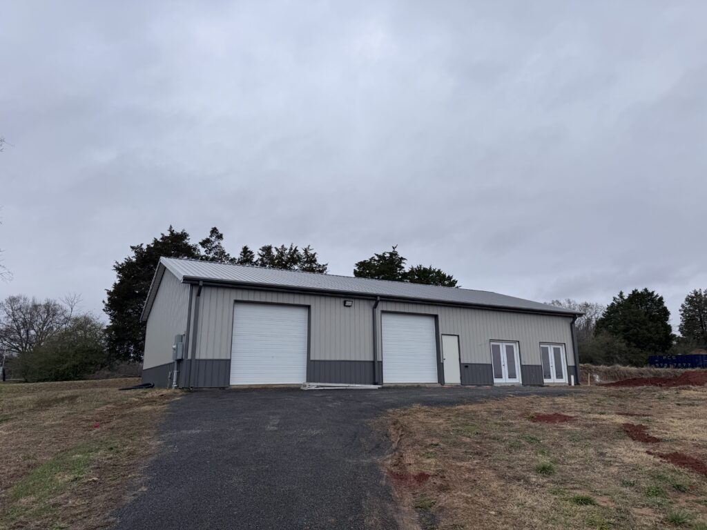 Image of a metal building on a hill.